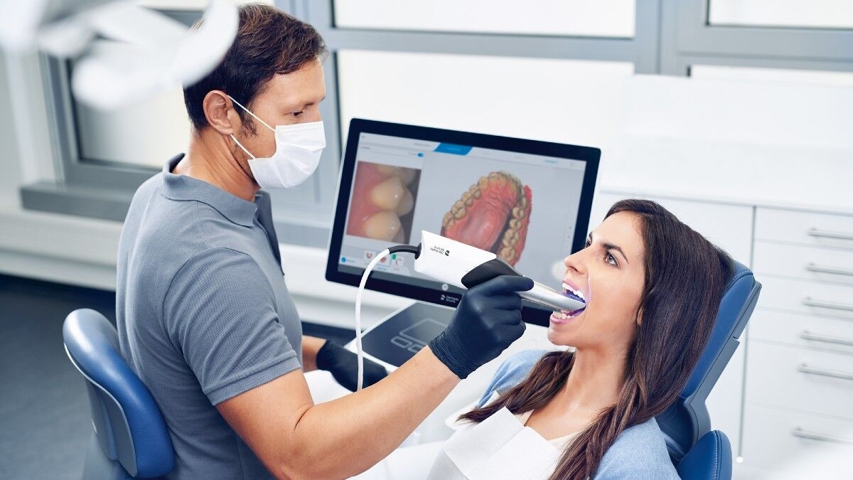 Dentist scanning patient with CEREC Primescan
